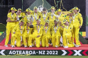 Australian players celebrate defeating England in the final.