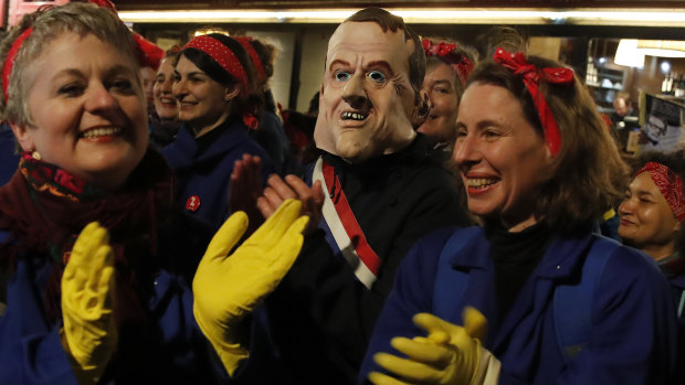 Women protest against French President Emmanuel Macron's pensions reform bill.