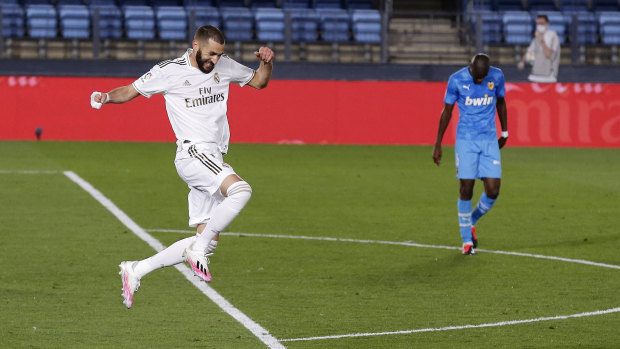 Karim Benzema celebrates his spectacular goal in Real Madrid's 3-0 dismantling of Valencia.