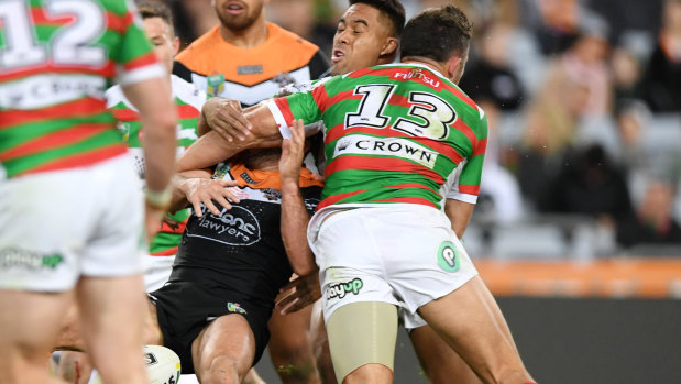 Flashpoint: Burgess collects Tigers hooker Farah across the face.