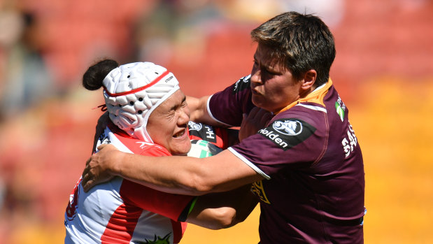 Heather Ballinger (right) tackles
the Dragons' Teina Clark during their NRL Women's Premiership match.