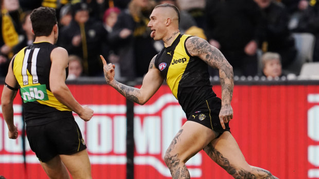Dustin Martin celebrates a goal against Brisbane at the MCG yesterday. The Tigers and Lions will meet at the Gabba in the finals. 