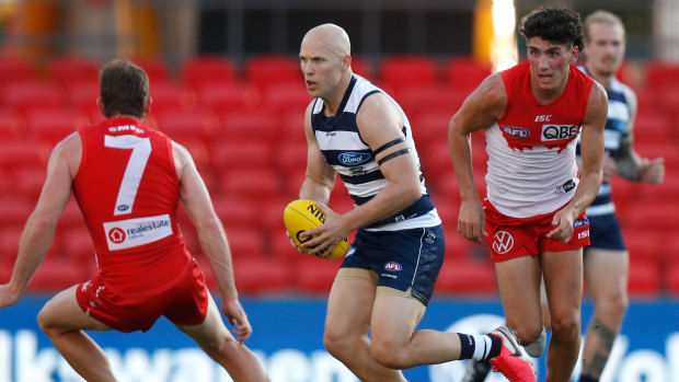 Good touch: Geelong's Gary Ablett in action against Sydney at Metricon Stadium on Sunday.