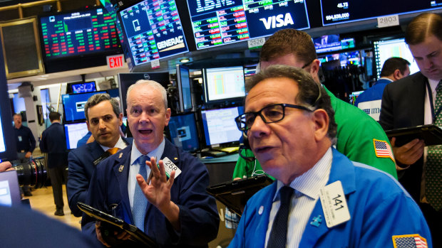 Traders on the floor of the New York Stock Exchange on Friday. Stocks rose for a fifth consecutive day, thanks to gains in the financial and information technology sectors. 