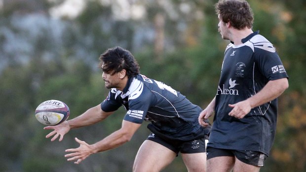 Hands on: Karmichael Hunt gets a feel for club rugby at   Bond University ground on Saturday.