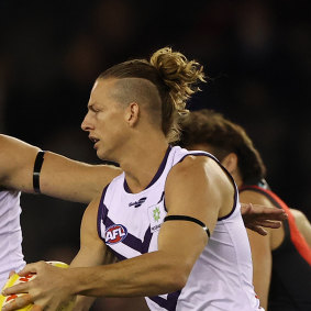 Nat Fyfe gets a kick against Essendon midway through last season