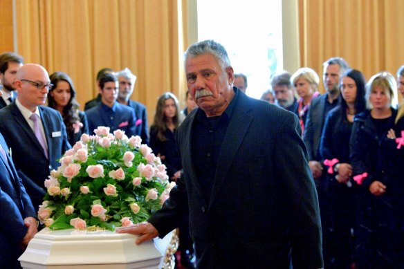 George Halvagis, father of Mersina, touches the coffin of Doncaster teenager Masa Vukotic at her funeral in 2015.