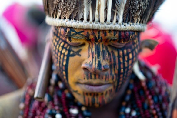 A member of an indigenous community joins a demonstration for indigenous land rights in Brasilia, Brazil, on Wednesday.  
