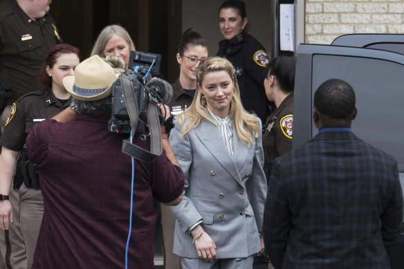 Actress Amber Heard leaves the Fairfax County Courthouse on Friday.