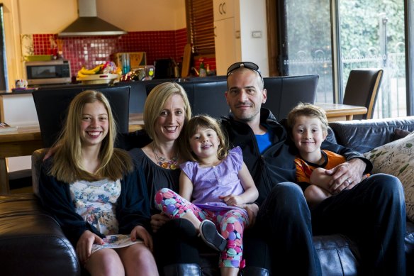 Katy Gallagher at her home in 2012 with her husband, David Skinner, and children, Abby, Evie and Charlie.
