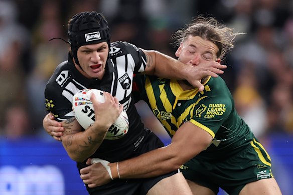 Kalyn Ponga tries to shrug off Maroons team-mate Pat Carrigan at Allianz Stadium.