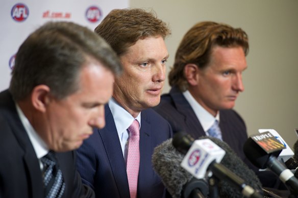 Essendon’s then chairman David Evans, centre, with chief executive Ian Robson, left, and coach James Hird when the club self-reported its supplements regime in 2013.