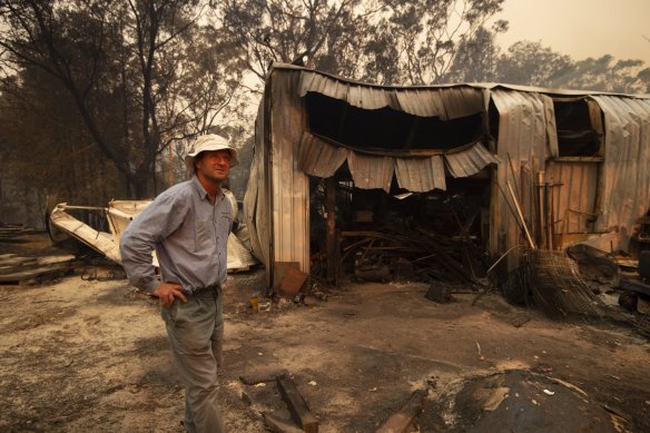 Rob Meggs inspects his shed after the Wrights Creek fire swept through Kyola Rd on the outskirts of Kulnura, west of the Central Coast. 