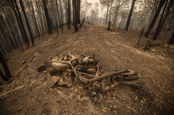 A burnt-out motorcycle on the fire ground in Taylors Arm near Macksville in northern NSW on Monday.