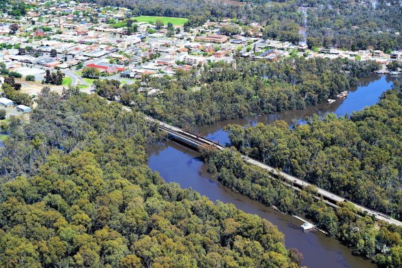 An aerial view of the existing Echuca Moama bridge with flooded forest. 