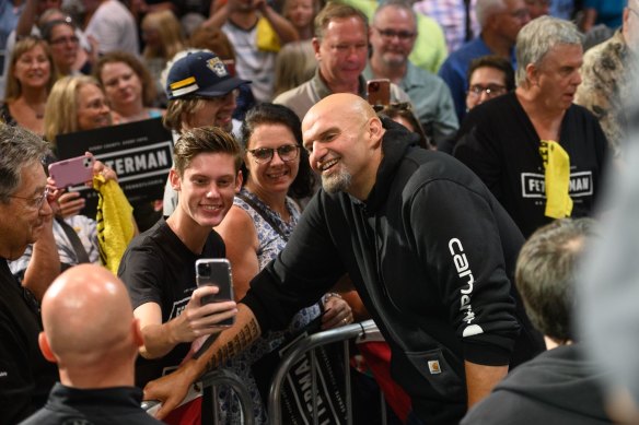 John Fetterman poses with fans in Erie.