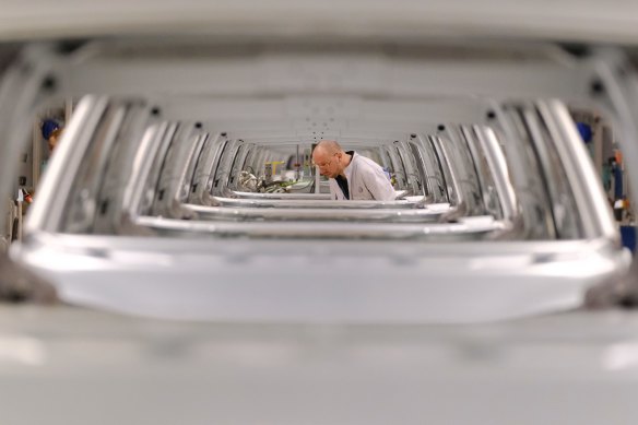 A worker is seen through the bodies of the ID.3 electric car at Volkswagen's Zwickau plant.