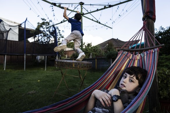 Sonny, 10, and Emmanuel, 7, play in the backyard of their Kingsford home on April 5, 2023. Their mother Tracey Adamson is part of a collective of parents, known as the Heads Up Alliance, who have agreed to delay their children’s use of social media and internet on their phones until they are 14.