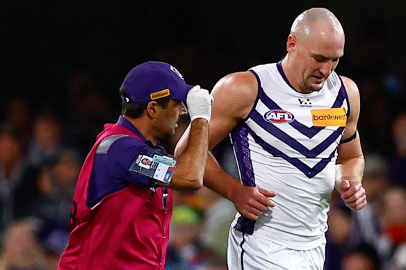 Brennan Cox of the Dockers leaves the field.