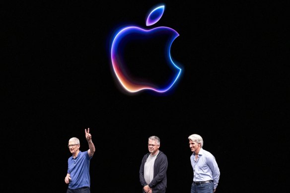 Tim Cook, chief executive of Apple, John Giannandrea, senior vice president of machine learning and AI strategy, and Craig Federighi, senior vice president of software engineering.