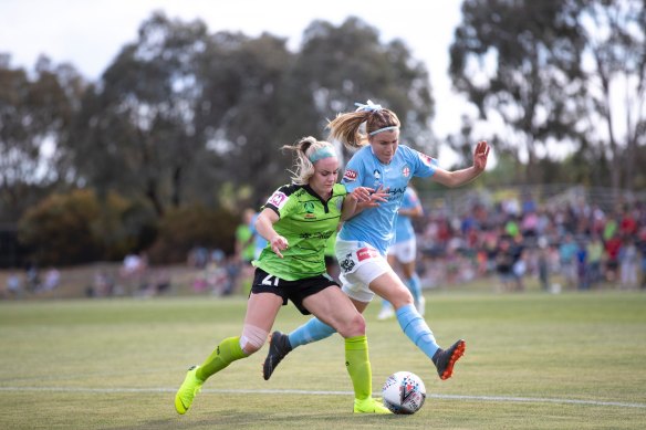 Chelsea Blissett (blue shirt), pictured during her time with Melbourne City, fights for possession with Matildas star Ellie Carpenter during the latter’s days with Canberra United.