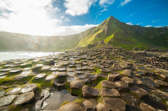 The Giant’s Causeway’s hexagonal basalt columns formed by ancient volcanic activity.