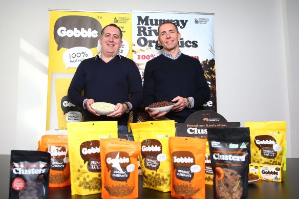 Murray River Organics former chief operating officer Jamie Nemtsas and former managing director Erling Sorensen, who founded the business. Posing with their products in July 2016 ahead of the company’s float on the ASX. 