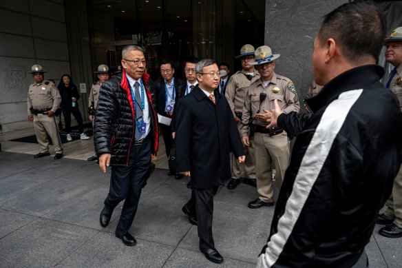 A protester reacts as delegates from China exit the St Regis Hotel on the sidelines of the Asia-Pacific Economic Cooperation summit in San Francisco.