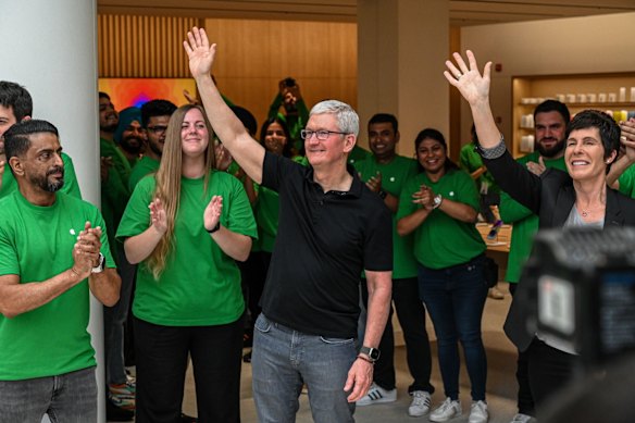 Tim Cook, chief executive officer of Apple, greeting customers in India.