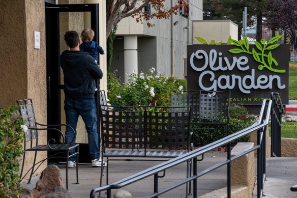 Customers enter an Olive Garden restaurant in Pittsburg, California.