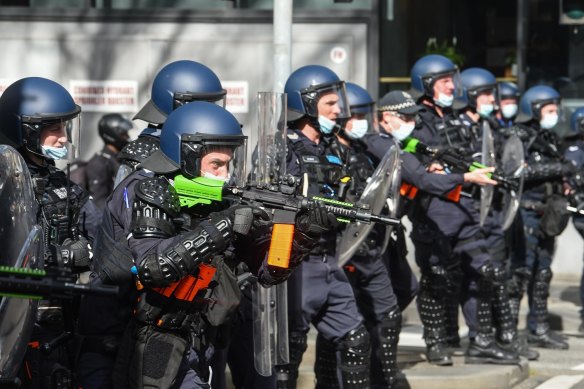 Police fire rubber bullets at protesters in Melbourne in August 2021.