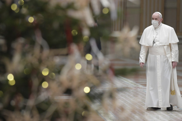 Pope Francis arrives to deliver the Urbi et Orbi message on Christmas Day.