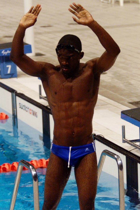 Eric Moussambani of Equatorial Guniea thanks the crowd after he swam his heat on his own after lanes 2 & 3 were disqualified.