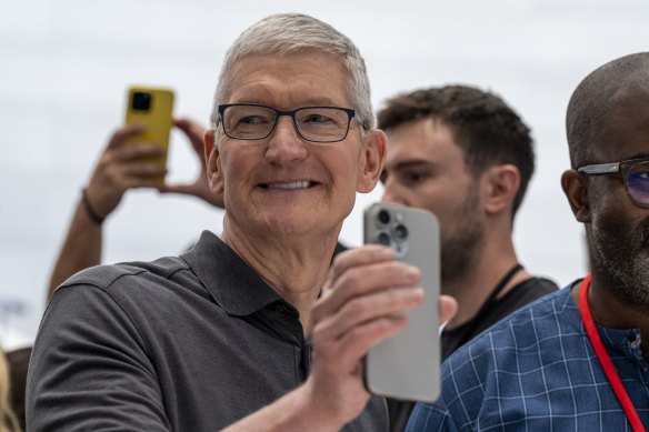Apple chief Tim Cook with the latest iPhone, the 15 Pro Max.