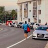 Jackson ‘Jacko’ Dooling, a Tamarama lifeguard, running towards the scene with a first aid backpack and no shoes. 