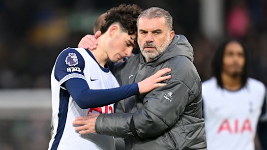 Ange Postecoglou consoles Archie Gray after Spurs loss.