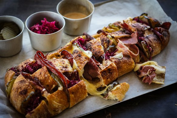 Share-friendly reuben sandwich drizzled with Russian mayo.