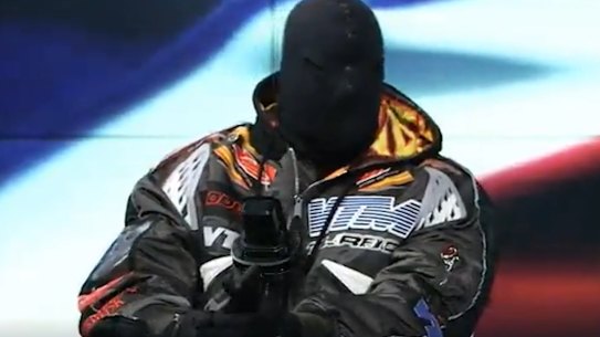 Kanye West, now known as Ye, appears masked and behind a copy of the Bible on Infowars on December 1. He also wore a mask to the BET Awards at the Microsoft Theatre in Los Angeles in June.