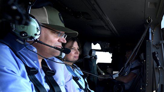 Scott Morrison and his wife Jenny survey the fires in Queensland in September.