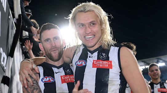 Arm in arm: Jeremy Howe and skipper Darcy Moore celebrate after the stunning win over the Giants.