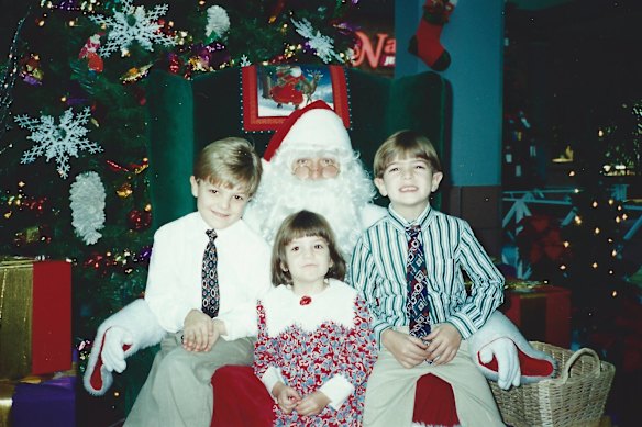 From left: Sean, his sister Samantha and brother Steven as children with Santa.