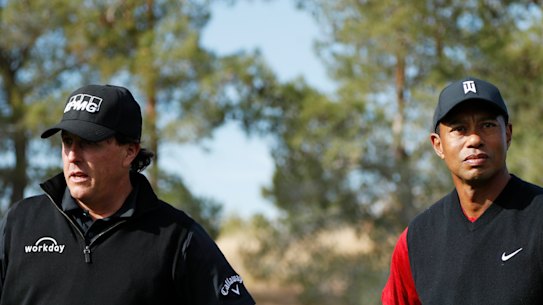 Phil Mickelson and Tiger Woods in happier times in 2018.