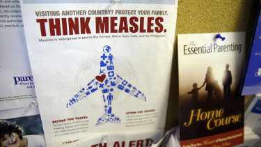 A flyer educating parents about measles is displayed on a bulletin board at a pediatrics clinic in Greenbrae, California. 