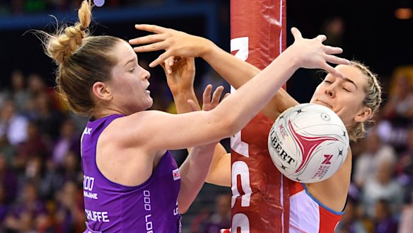 Injury doubt: Sophie Garbin, right, tangles with Tara Hinchliffe of the Firebirds.