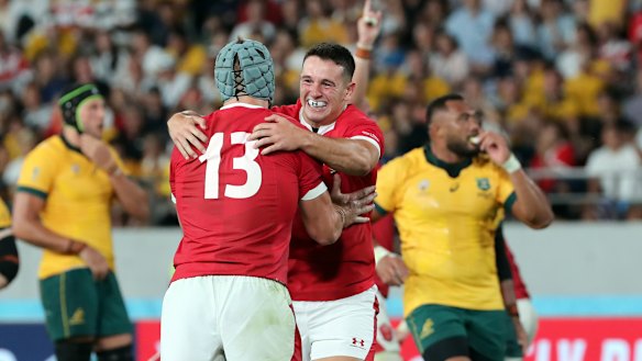 Wales players celebrate their thrilling win over Australia on Sunday. 