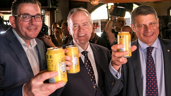 Opposition leader Bill Shorten and Premier of Victoria Daniel Andrews with former Premier Steve Bracks, toast the Labor legend with a Hawke's tinny. 