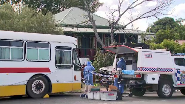 A forensic team looks for clues at Pheobe Bishop’s Gin Gin home. 