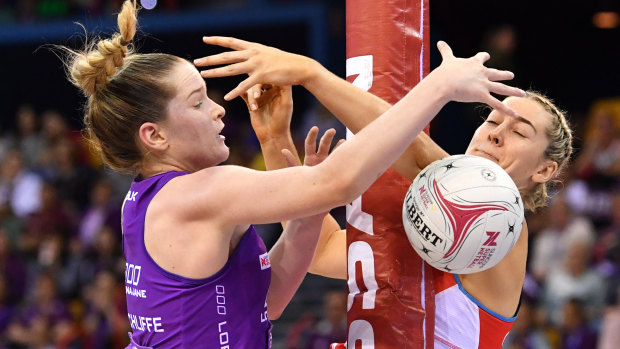 Injury doubt: Sophie Garbin, right, tangles with Tara Hinchliffe of the Firebirds.