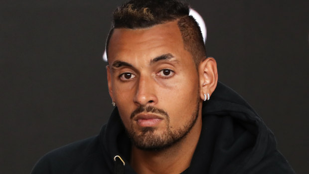 Lips are sealed: Nick Kyrgios speaks to the media at a press conference on day two of the Australian Open.