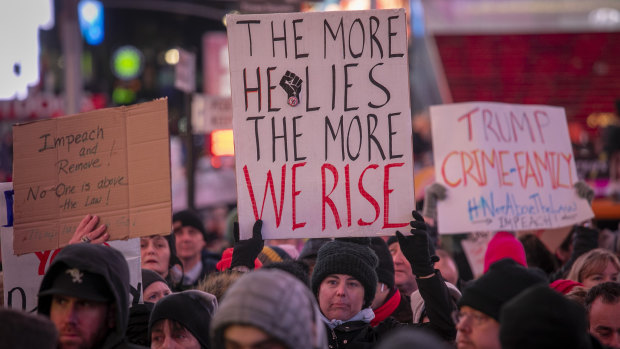 An anti-President Donald Trump crowd gather at a rally to call for his impeachment in New York on Tuesday.